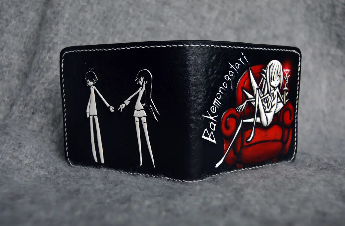 A black leather wallet with white stitching features anime-style illustrations: two stylized figures holding hands on one…