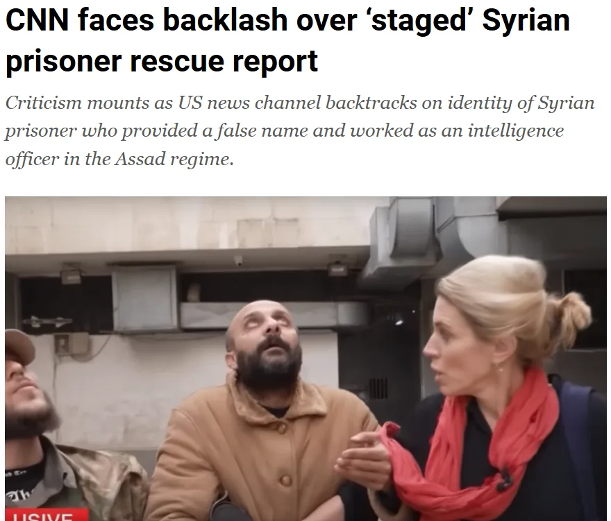 A screenshot of a CNN news article headline about a 'staged' Syrian prisoner rescue report, overlaid on a photo of a female…