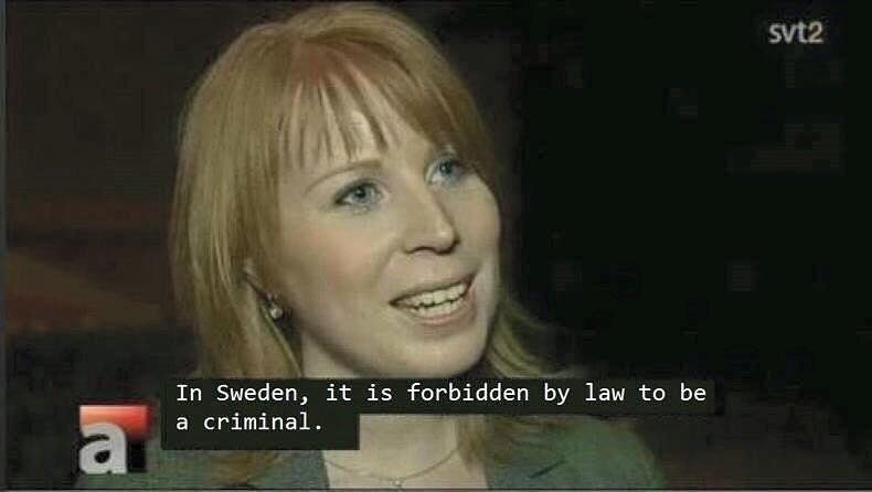 A woman with reddish-blonde hair and a slight smile is shown in a TV interview, with the text overlay 'In Sweden, it is…