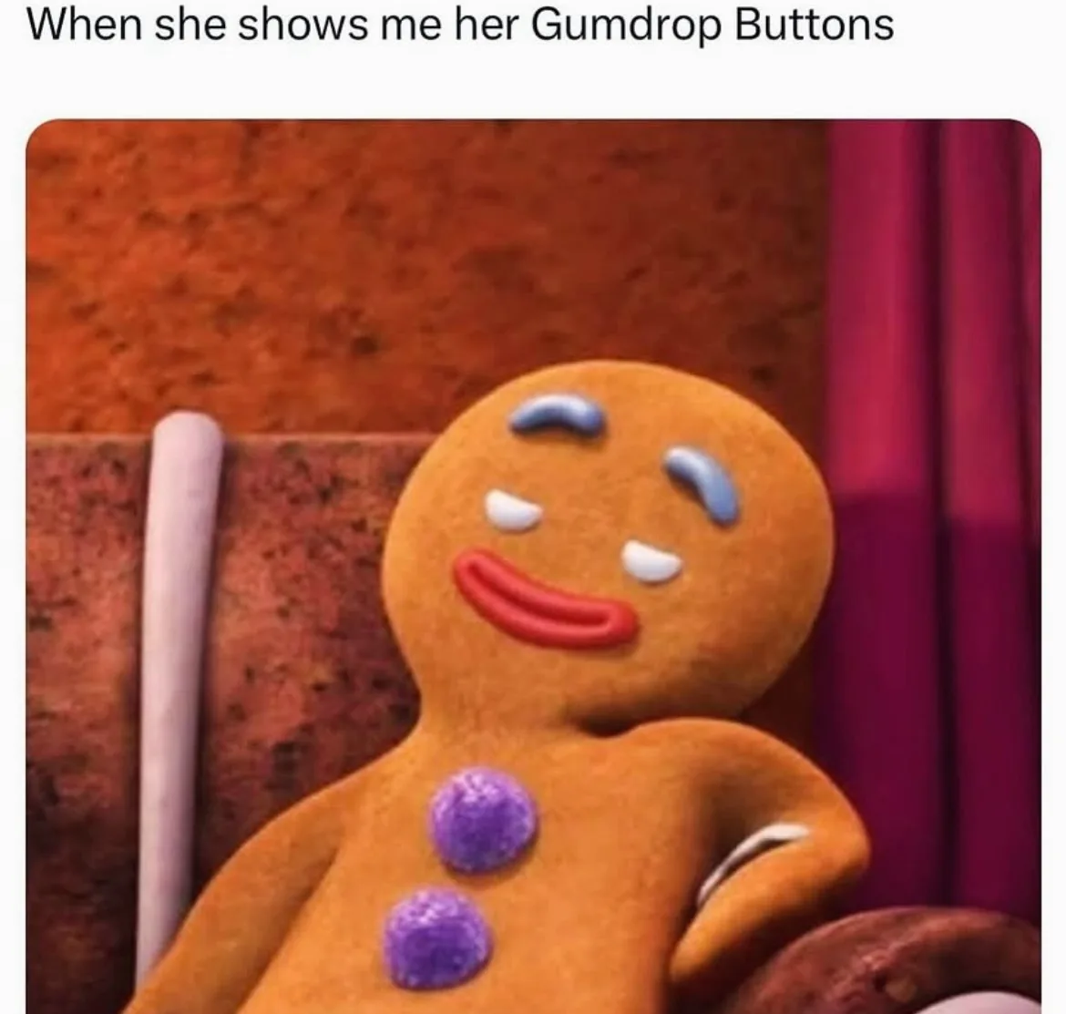 A close-up of a gingerbread man character with a smug, self-satisfied expression, featuring blue icing eyebrows, white icing…