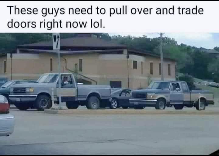 Two pickup trucks are parked side-by-side in a lot, with their front passenger doors touching each other. The overlaid text…