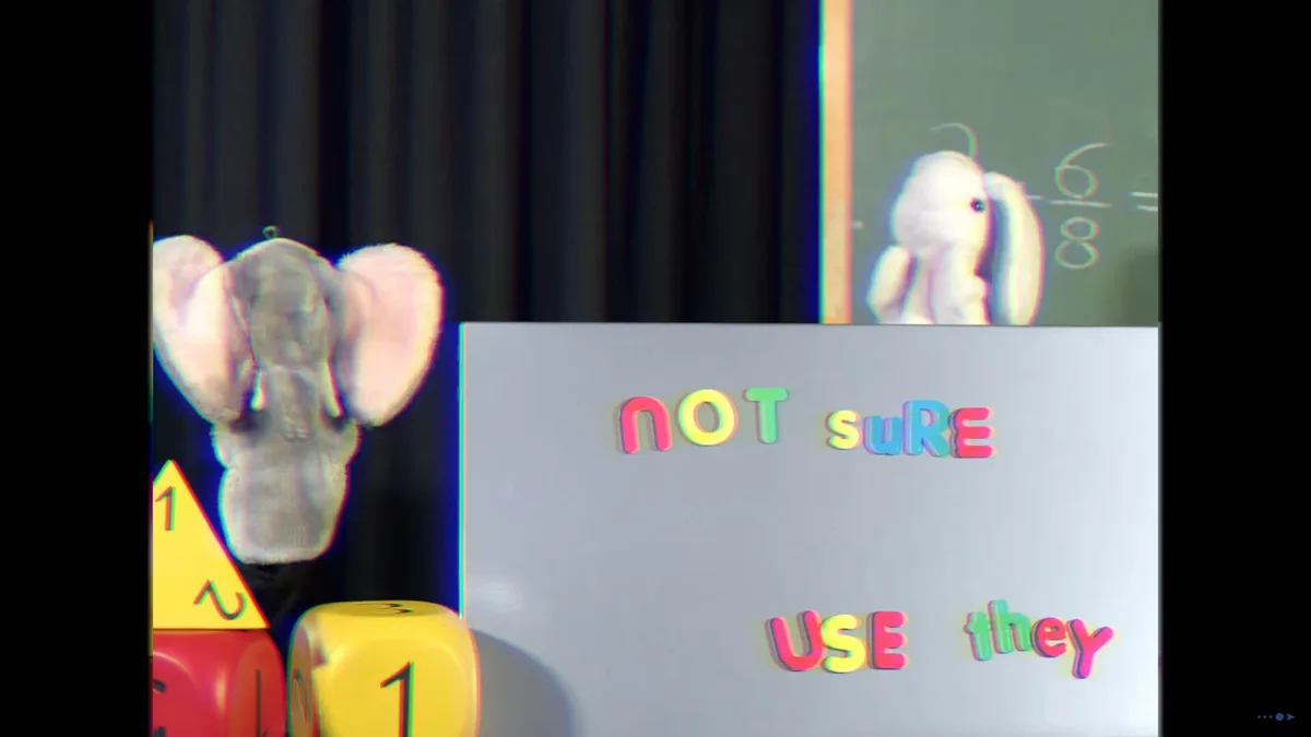 A split-screen image shows a plush elephant puppet on the left and a plush rabbit puppet on the right, both in front of a…