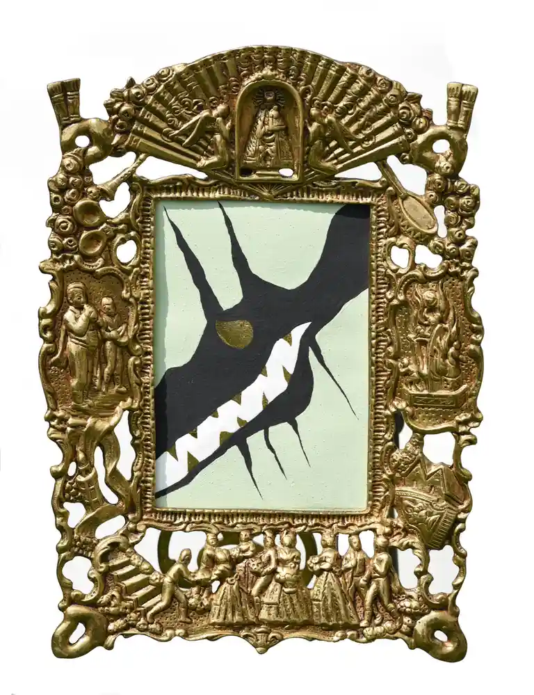 An ornate, gilded picture frame with intricate religious and figurative carvings surrounds a minimalist painting of two…