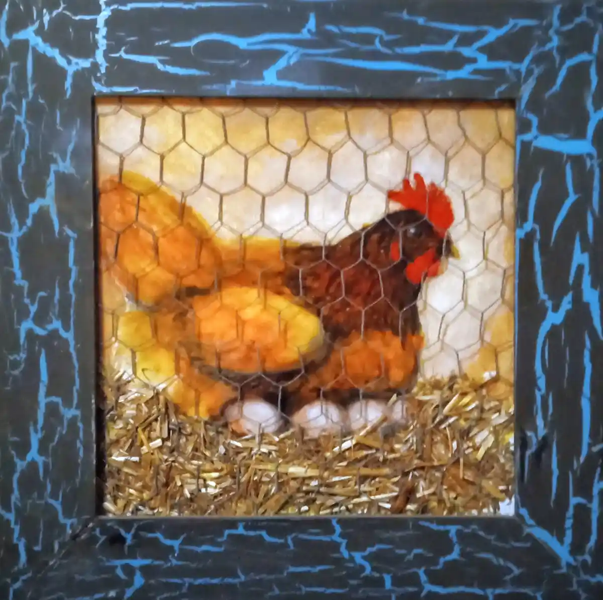 A framed painting depicts a brown hen with a red comb sitting on eggs in a nest of straw, viewed through hexagonal chicken…