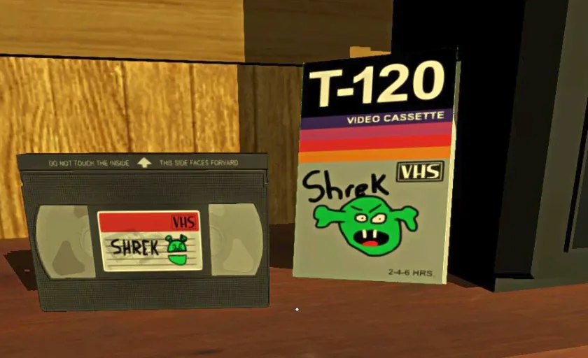 A VHS tape and its case for the movie 'Shrek' are shown side by side on a wooden surface. The tape's label has a handwritten…