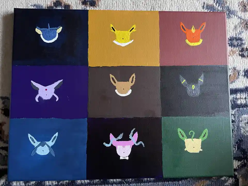 A hand-painted canvas divided into nine colored squares, each featuring a stylized, minimalist drawing of a different…