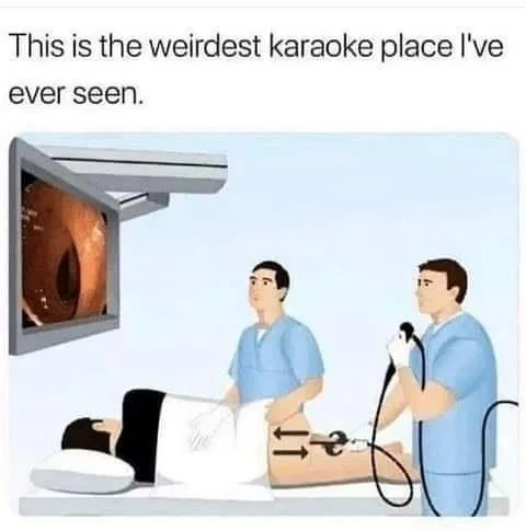 An illustration shows a patient lying on a medical table while two doctors in scrubs perform a colonoscopy. One doctor holds…