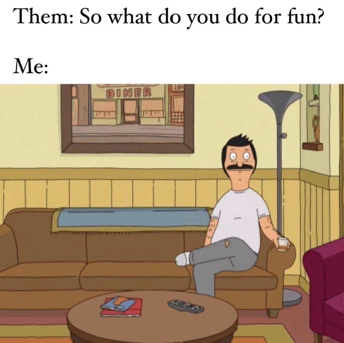 The image shows Bob Belcher from the animated show 'Bob's Burgers' sitting on a brown couch in his living room, holding a…