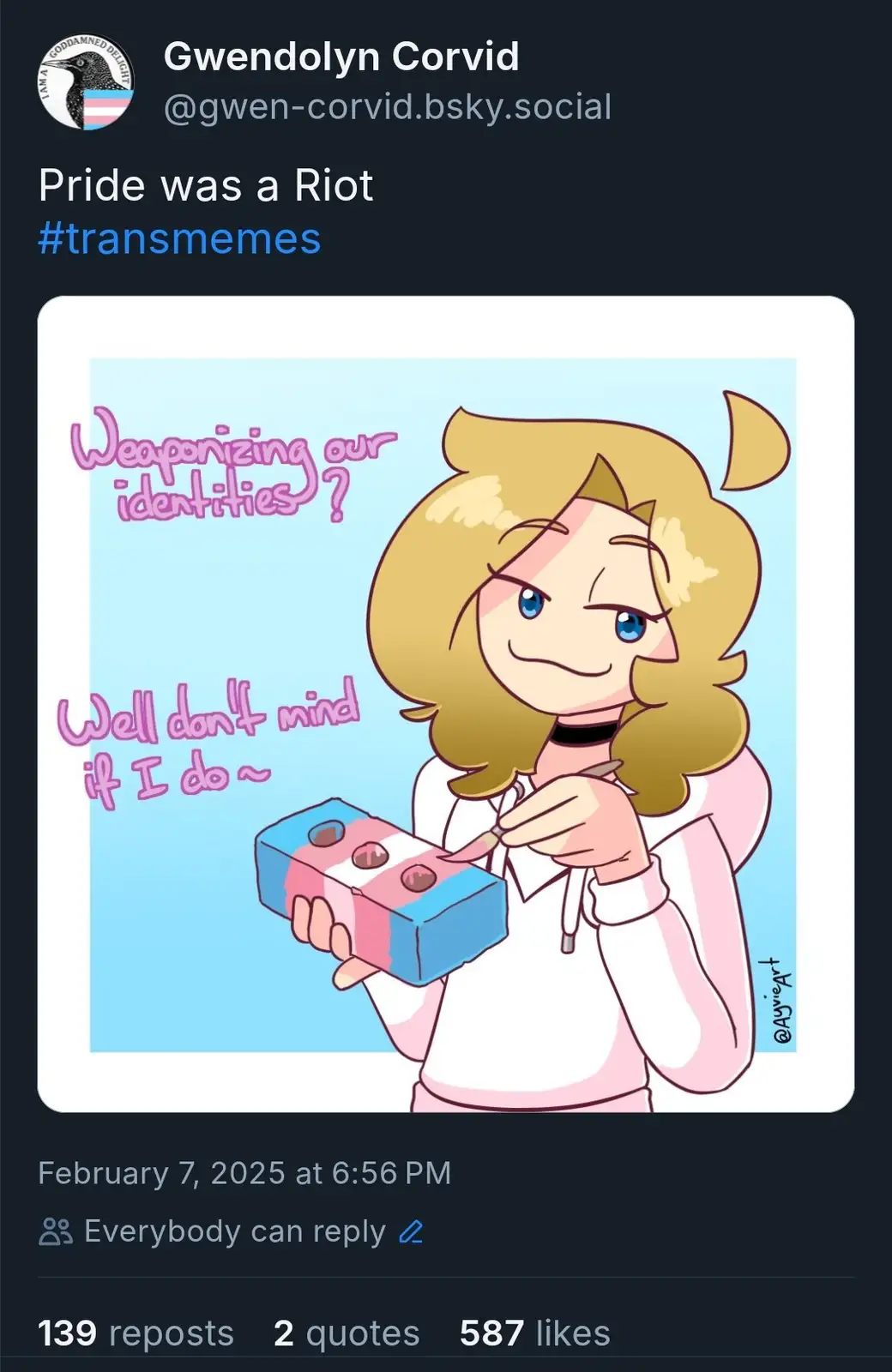 An anime-style illustration shows a blonde-haired character with cat ears holding a block painted with the transgender flag…