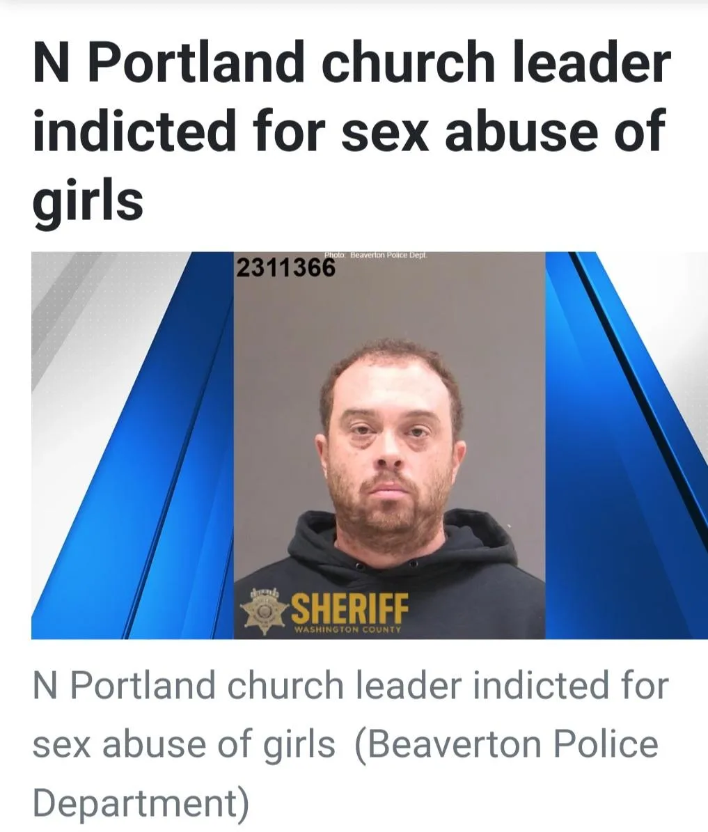 A mugshot of a man with short brown hair and a beard wearing a black hoodie with 'SHERIFF WASHINGTON COUNTY' in yellow text…