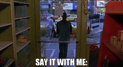 A split-screen image shows a man in a store looking out the window at a street scene with a taxi. The text "SAY IT WITH ME:"…