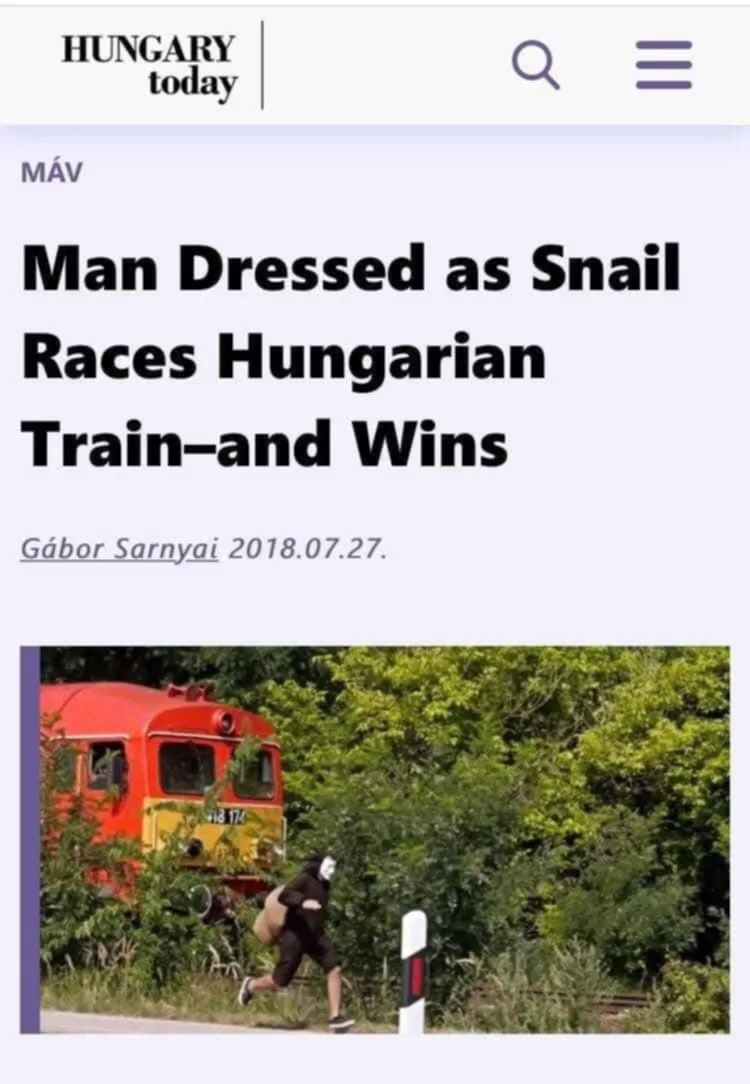 A screenshot of a news article from 'Hungary Today' shows a person in a snail costume running beside a red train. The…