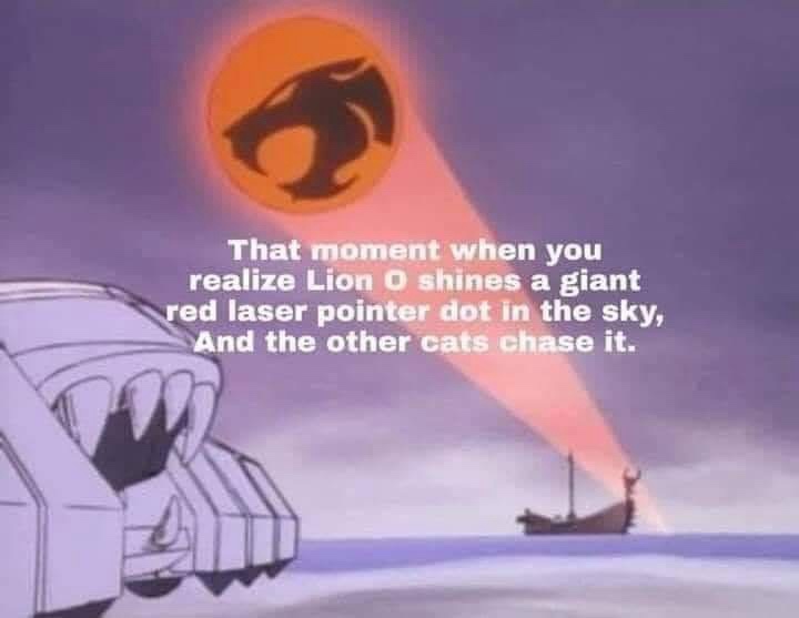 An animated scene from Thundercats shows a giant orange sun with a black lion head symbol, emitting a red beam of light that…