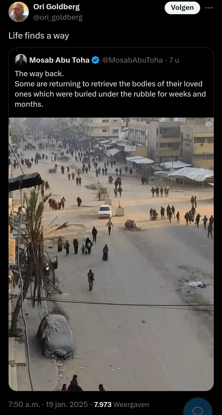 A screenshot of a tweet by Mosab Abu Toha showing a wide, damaged urban street filled with people walking among rubble and…