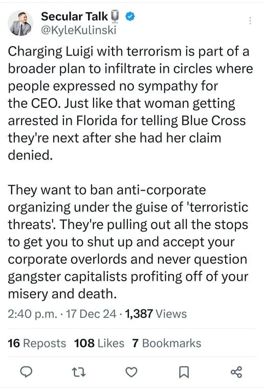 A screenshot of a tweet from 'Secular Talk' (@KyleKulinski) with a long text overlay criticizing corporate power, using the…