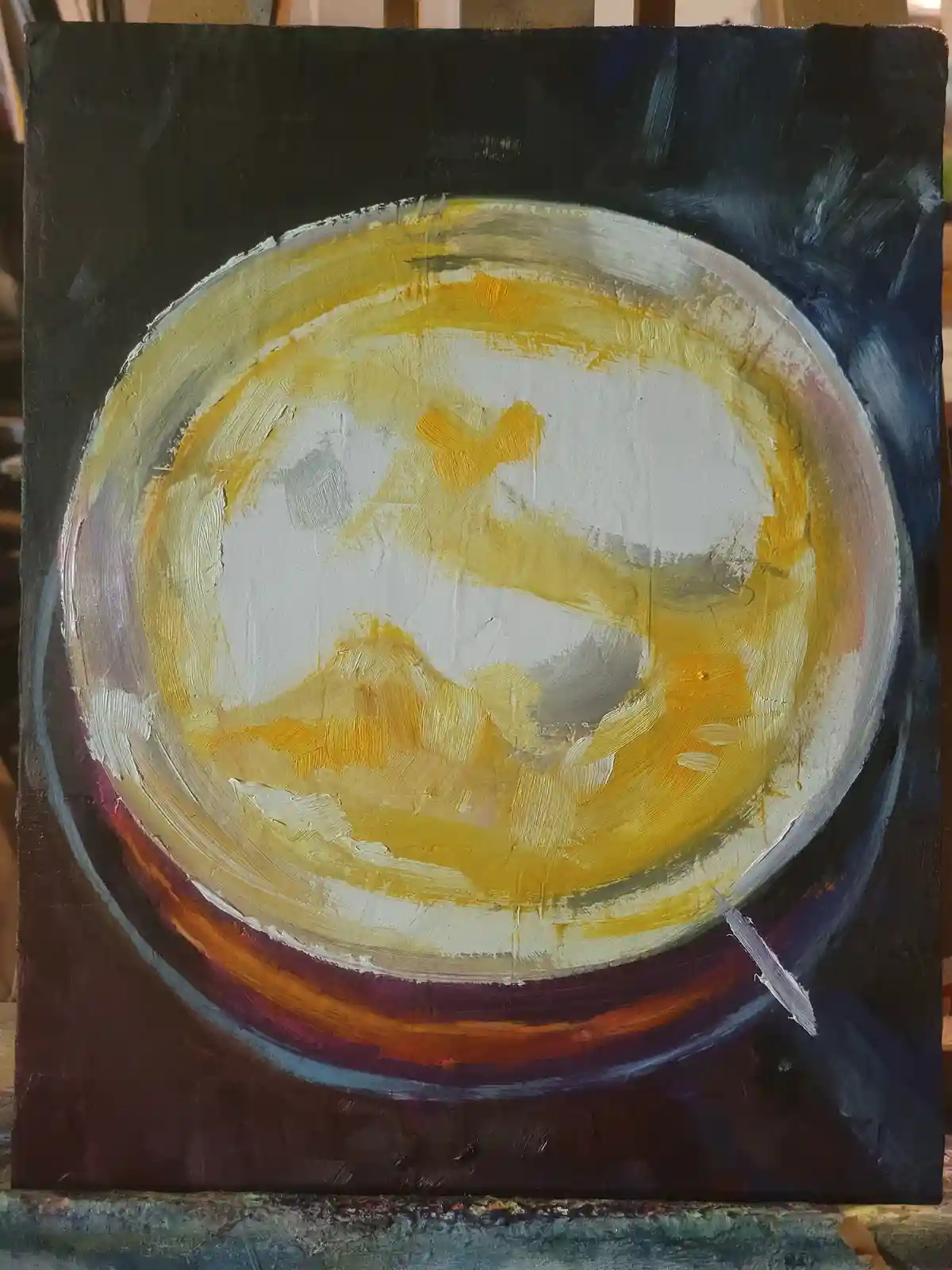 An abstract oil painting on canvas depicts a circular, bowl-like shape with thick, textured brushstrokes in yellow, white…