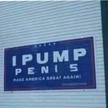 A blurry image of a blue sign on a building facade reads 'IPUMP PENI 5' in large white letters, with 'MAKE AMERICA GREAT…