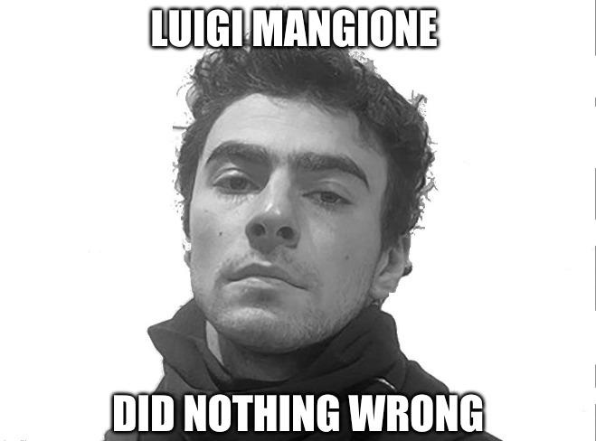 A black and white close-up photo of a man with dark, curly hair and a neutral expression, wearing a dark hoodie. The text…