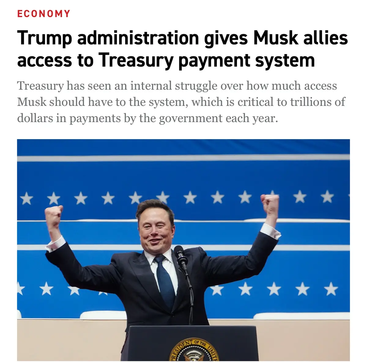 A man in a suit stands at a podium with the presidential seal, raising both fists in triumph against a blue backdrop with…