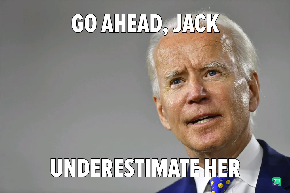 A close-up photo of Joe Biden looking slightly upward with a knowing expression, wearing a blue suit and patterned tie…