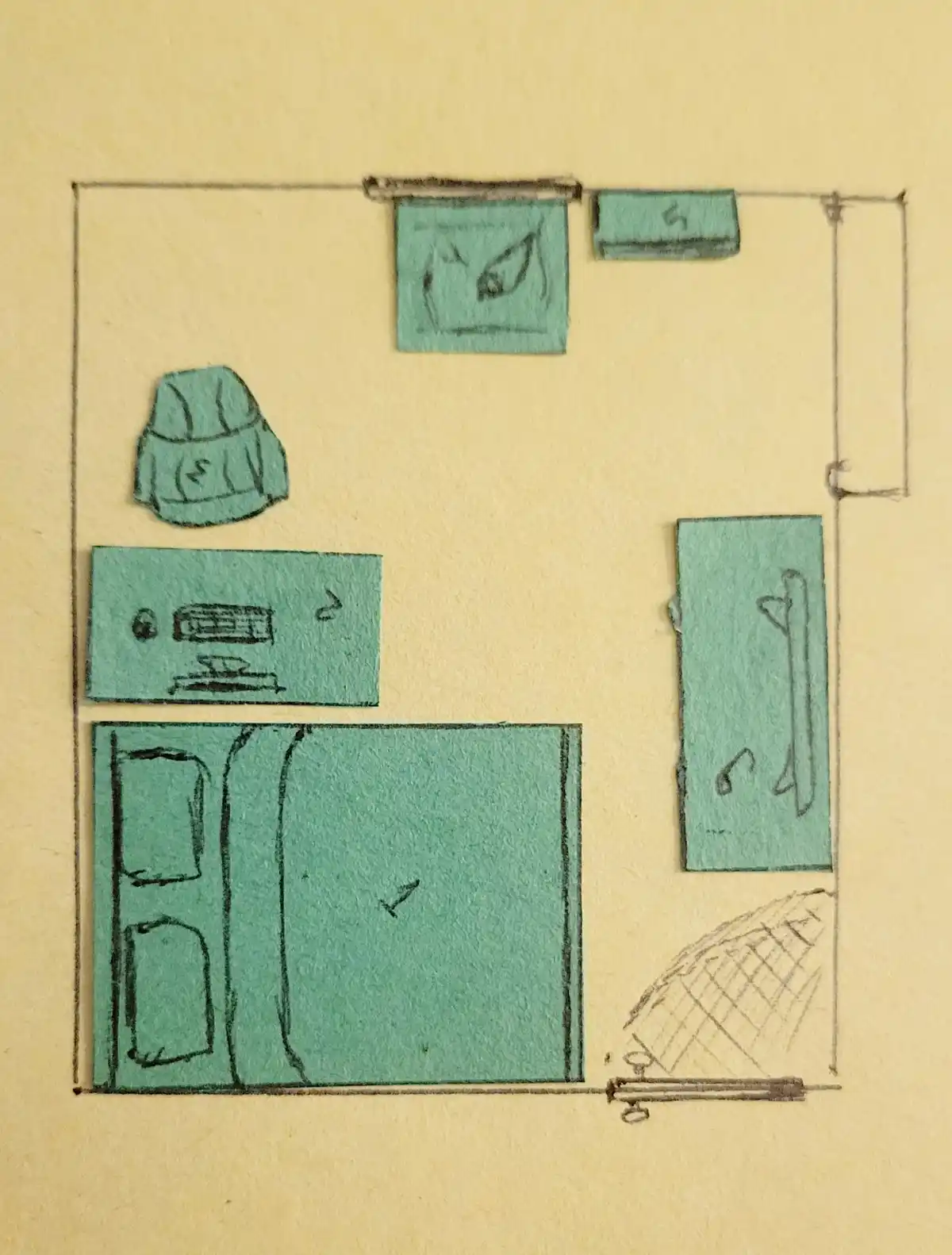 A hand-drawn, top-down diagram of a room on beige paper, with teal-colored cutouts representing furniture and items like a…
