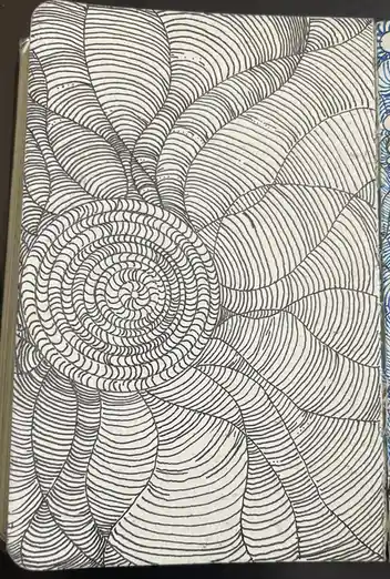 A black-and-white drawing on paper shows a complex spiral pattern made of concentric, wavy lines radiating outward from a…