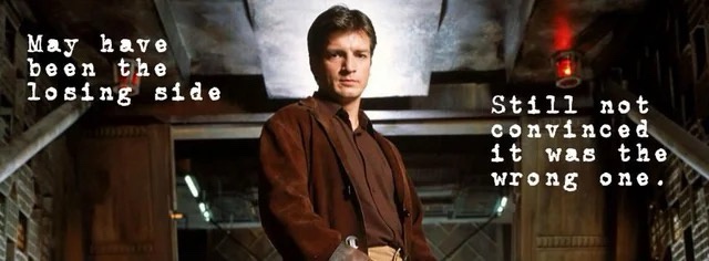 A man in a brown jacket stands in a dimly lit, industrial-style corridor with pipes and metal structures. White text is…