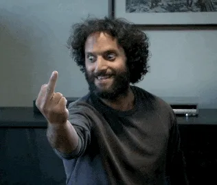 A man with curly dark hair and a beard, wearing a dark gray shirt, is shown in six sequential frames. In the top three…