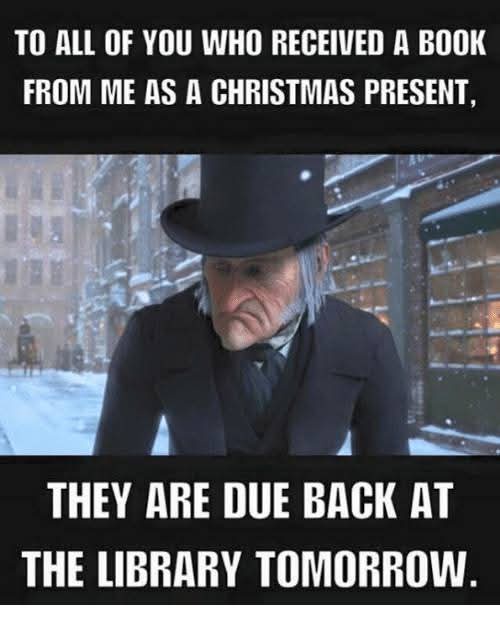 A stern-looking elderly man in a top hat and dark coat stands in a snowy urban street, looking down with a displeased…