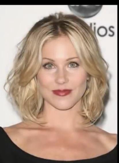 A woman with blonde, shoulder-length wavy hair and a black top looks at the camera. Overlaid text reads 'i'm not a fan of…