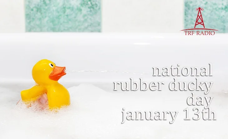 A yellow rubber duck sits in a bubble-filled bathtub, appearing to spray water from its beak. Text overlaid on the image…