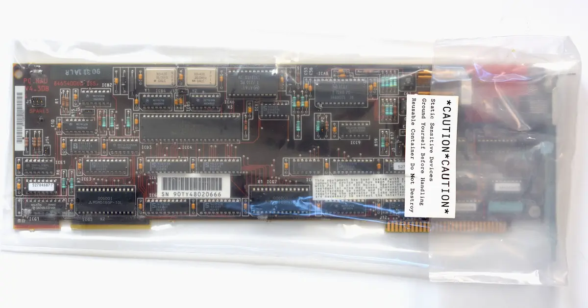 A vintage AT&T PC Nau motherboard, model V4.30B, is shown inside a clear plastic bag. The board is densely populated with…