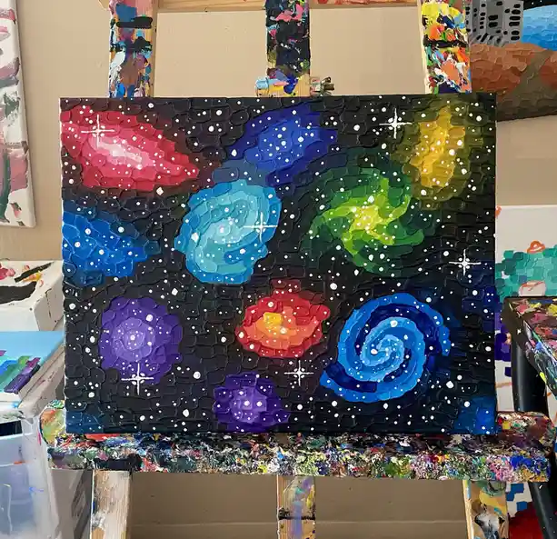 A thickly textured, colorful galaxy painting on canvas, featuring swirling nebulae in red, blue, green, purple, and orange…