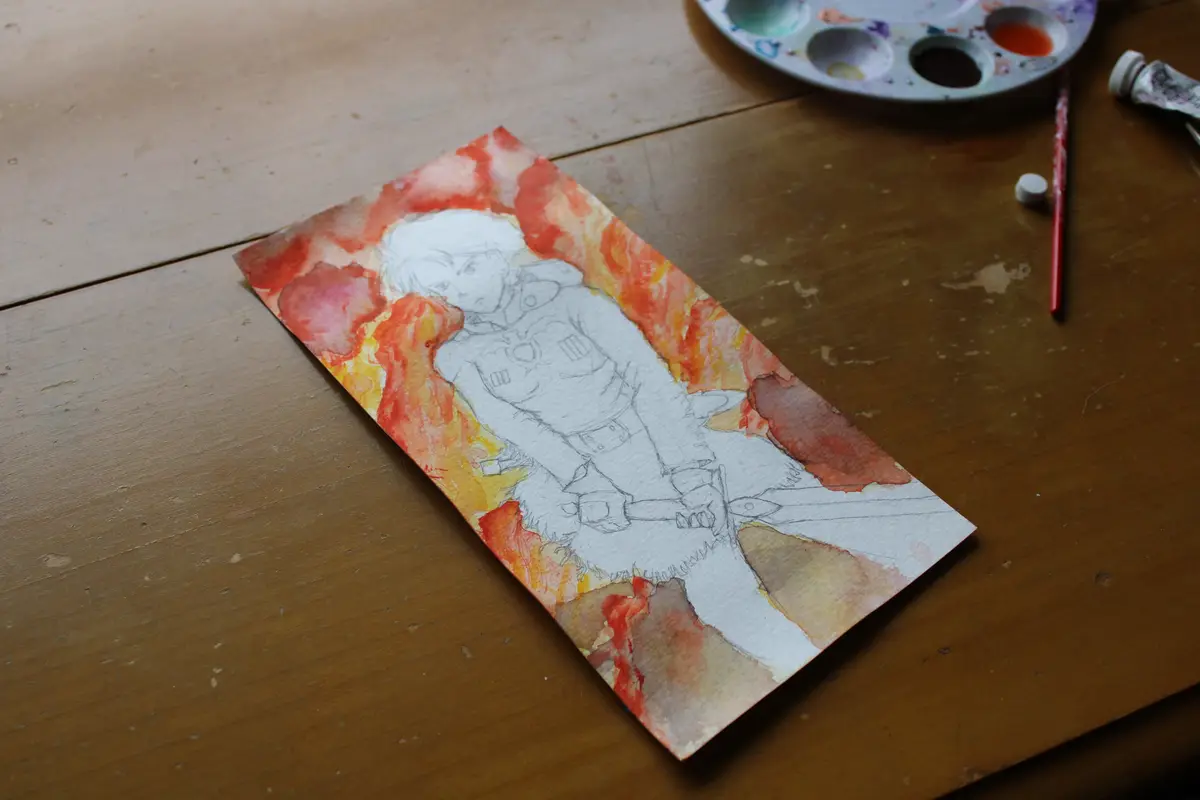 A watercolor painting on paper shows a partially completed anime-style character sketch with red and orange washes around…