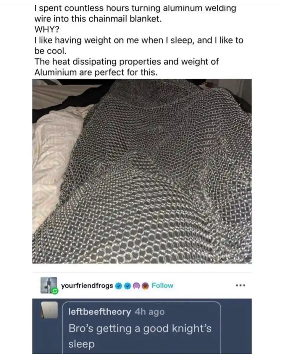 A photo of a silver chainmail blanket draped over a bed, with overlaid text explaining the creator spent hours making it…
