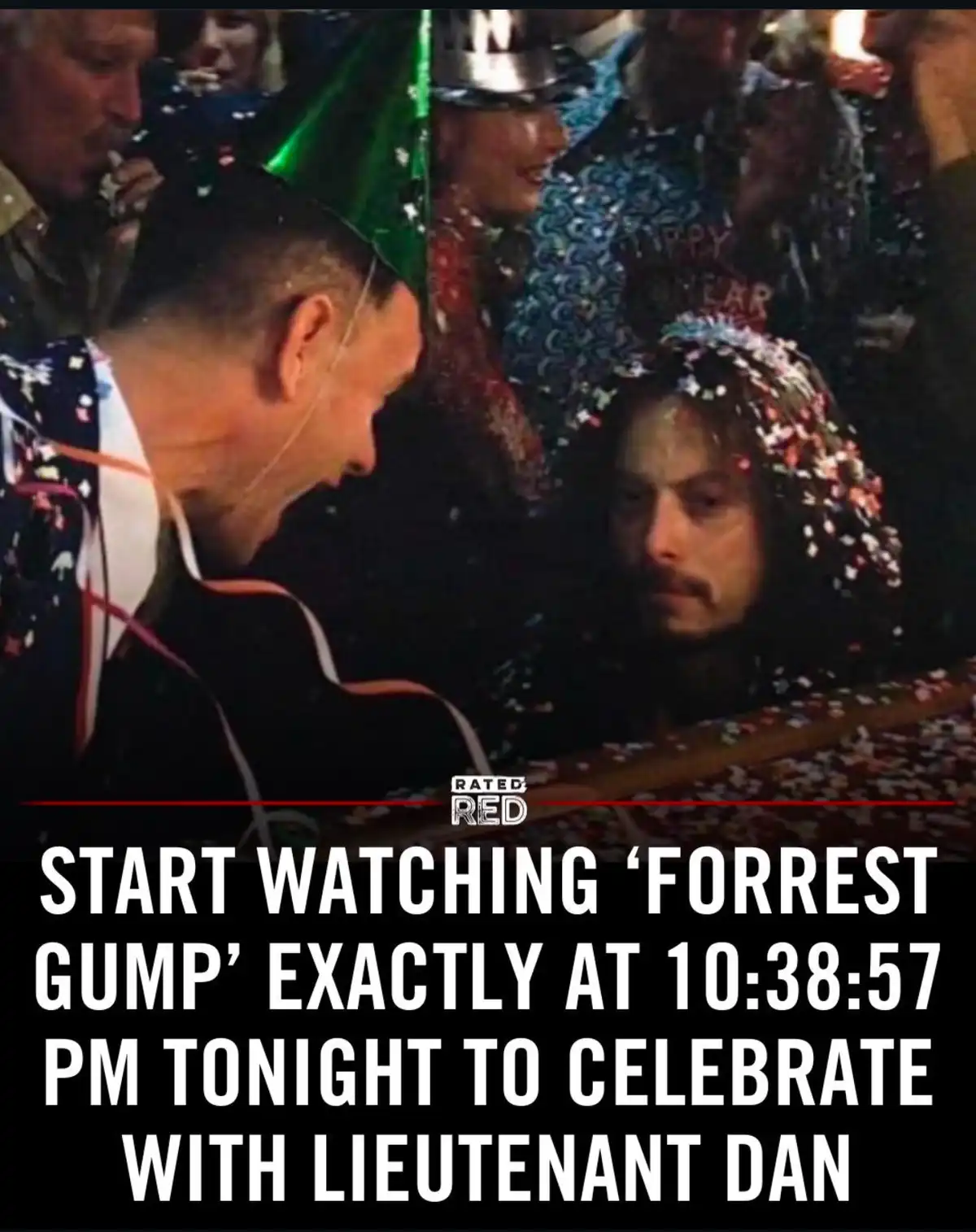 A man in a party hat leans toward another man covered in confetti, both looking at each other in a crowded, festive setting…