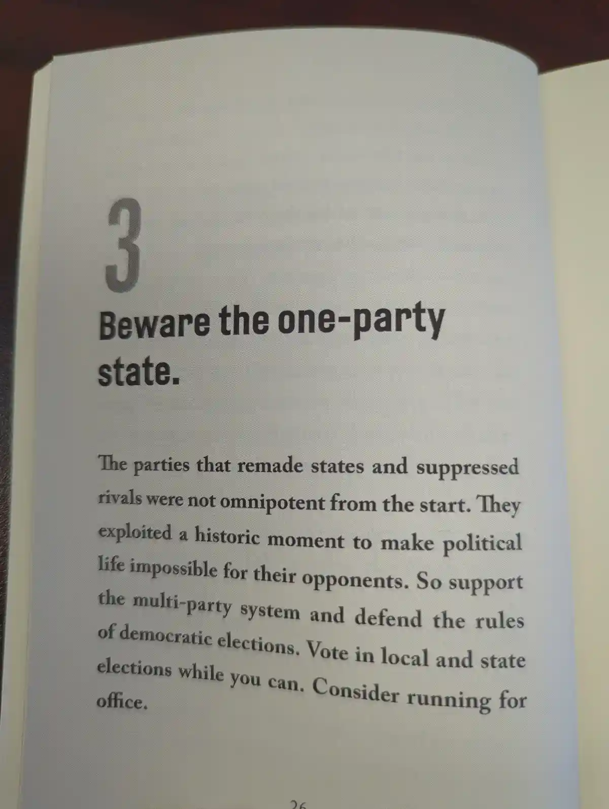 A close-up photo of a book page with the heading '3 Beware the one-party state.' followed by a paragraph urging support for…