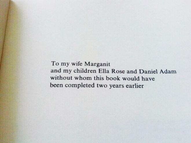 A close-up photo of a book's dedication page, printed in black serif font on white paper. The text reads: 'To my wife…