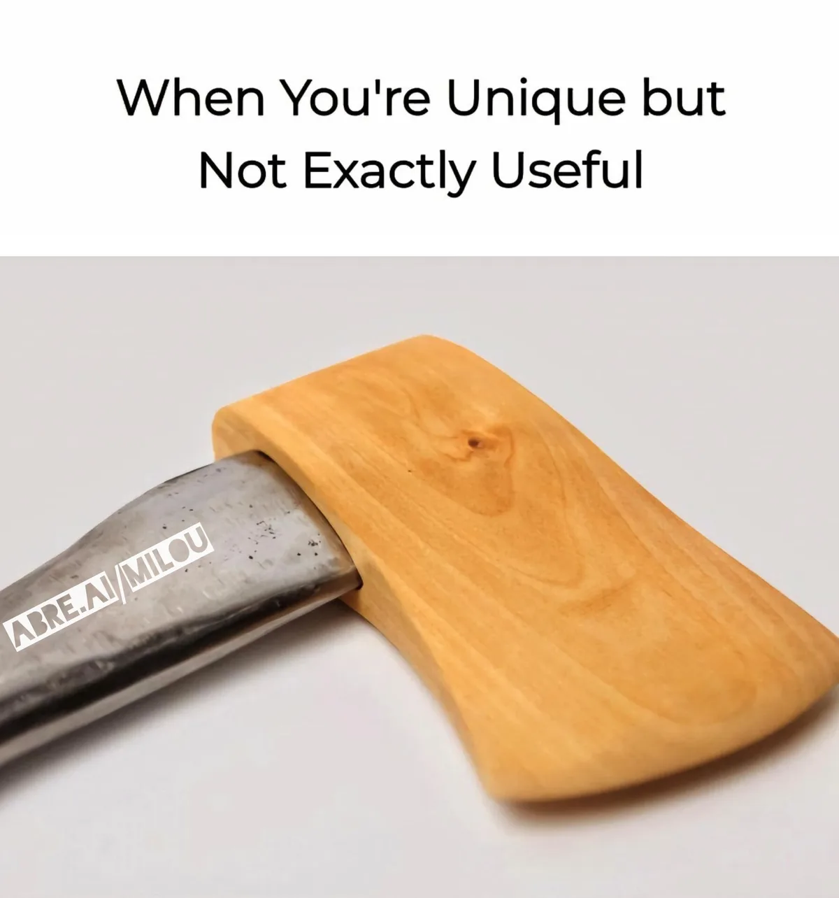 The image shows a close-up of an axe head with a wooden handle, but the handle is shaped like a flat, rectangular block of…