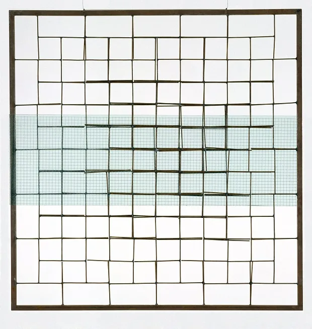 A square metal grid with a horizontal band of translucent grid material overlaid across the middle. The overlaid text reads…